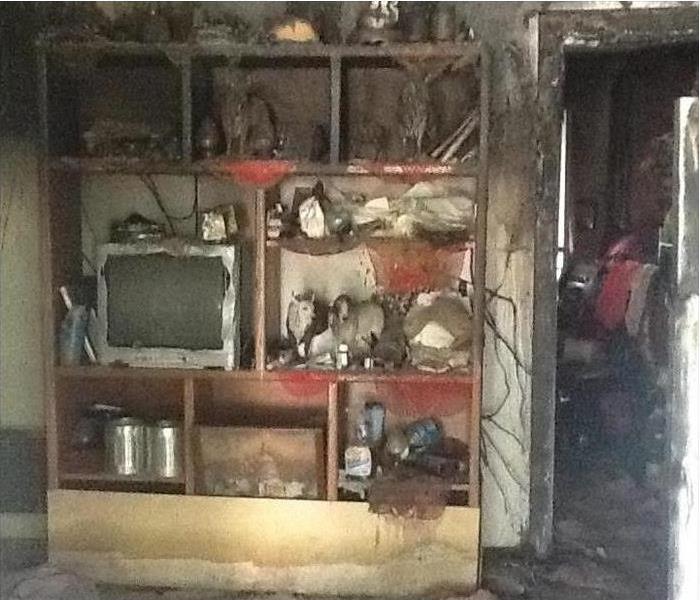 Furniture with TV and other ornaments damaged by fire